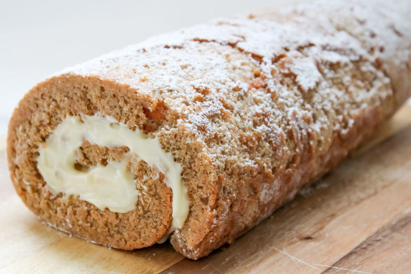 Carrot cake Swiss roll with cream cheese icing/frosting