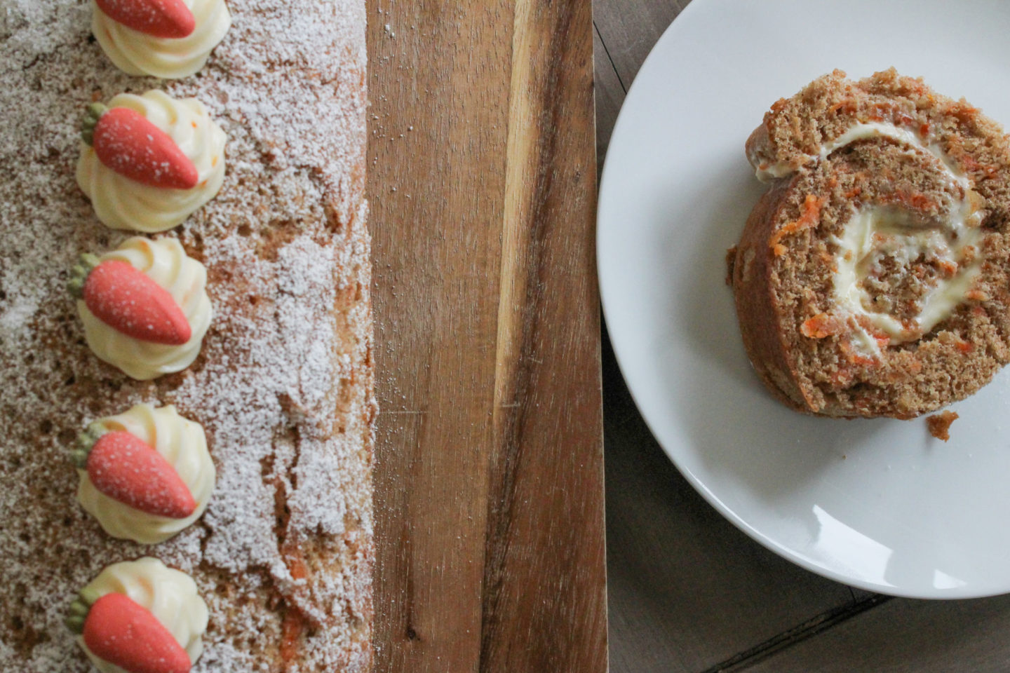 Overhead view of carrot cake Swiss roll and a slice of the cake