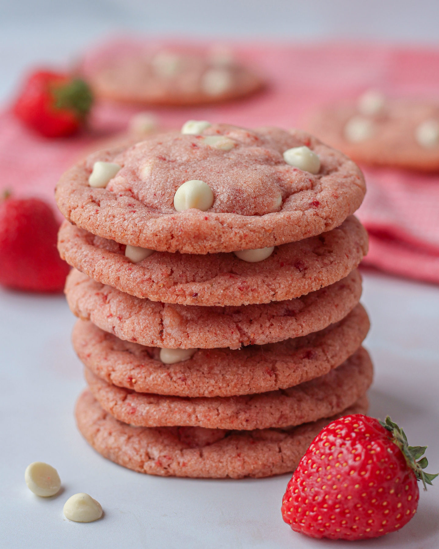 close up of a tower of strawberry white chocolate cookies
