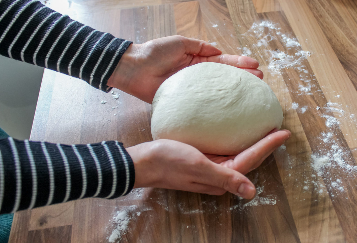 shaping a cob loaf by hand