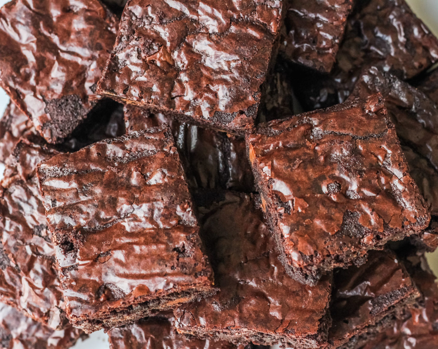 close up of brownies with shiny tops