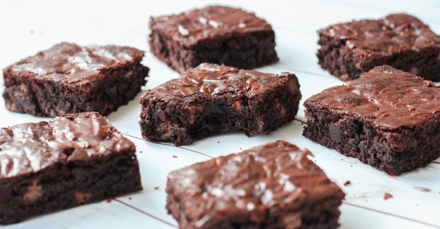 several brownies, once with bite taken to show inside of brownie