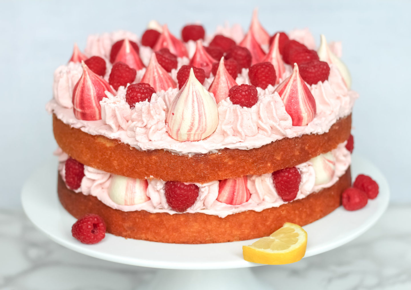 lemon raspberry cream cake with meringue kisses