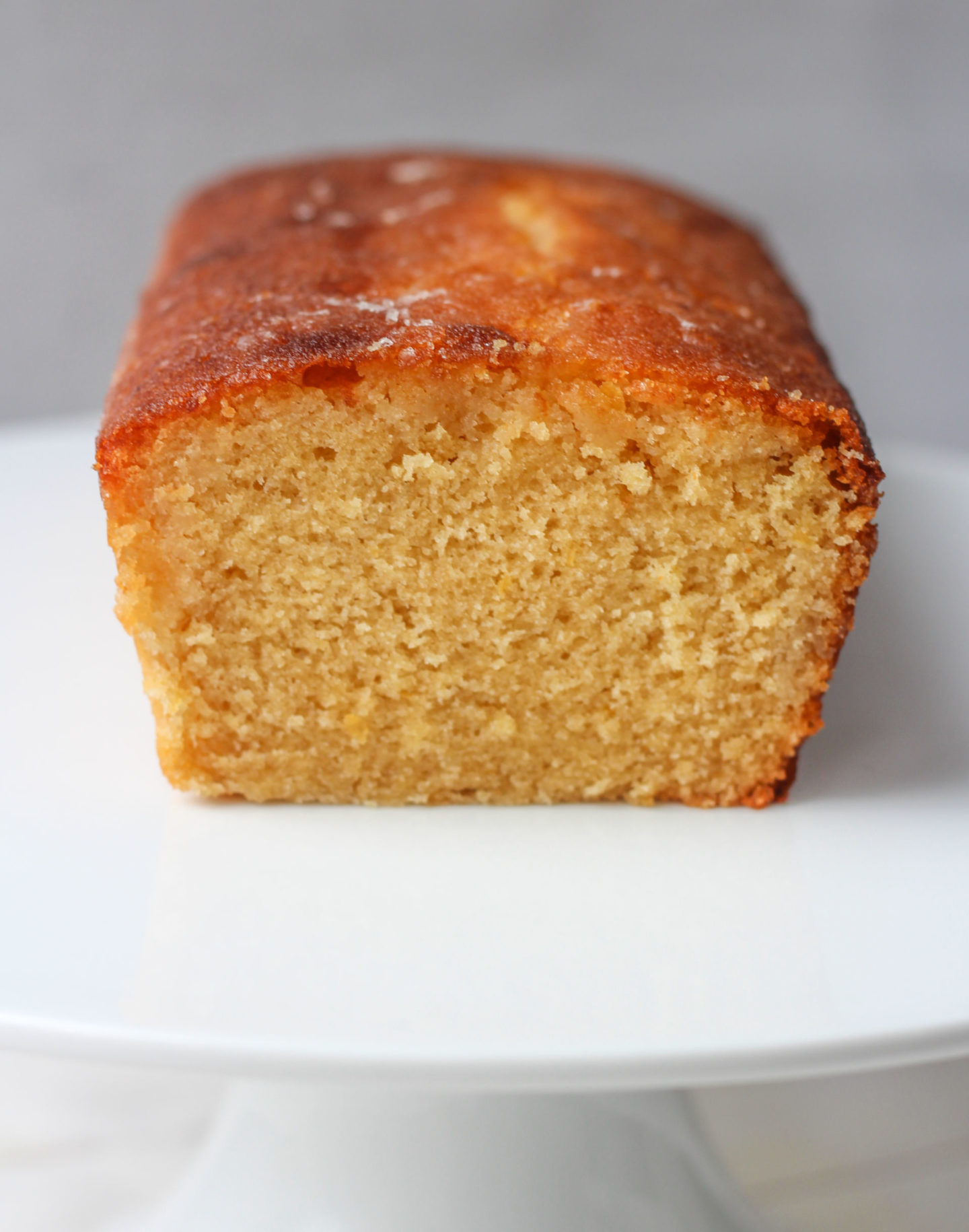 close up of inside of lemon drizzle loaf cake