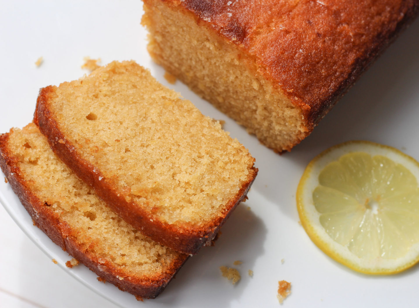 shot from above of sliced lemon drizzle loaf cake