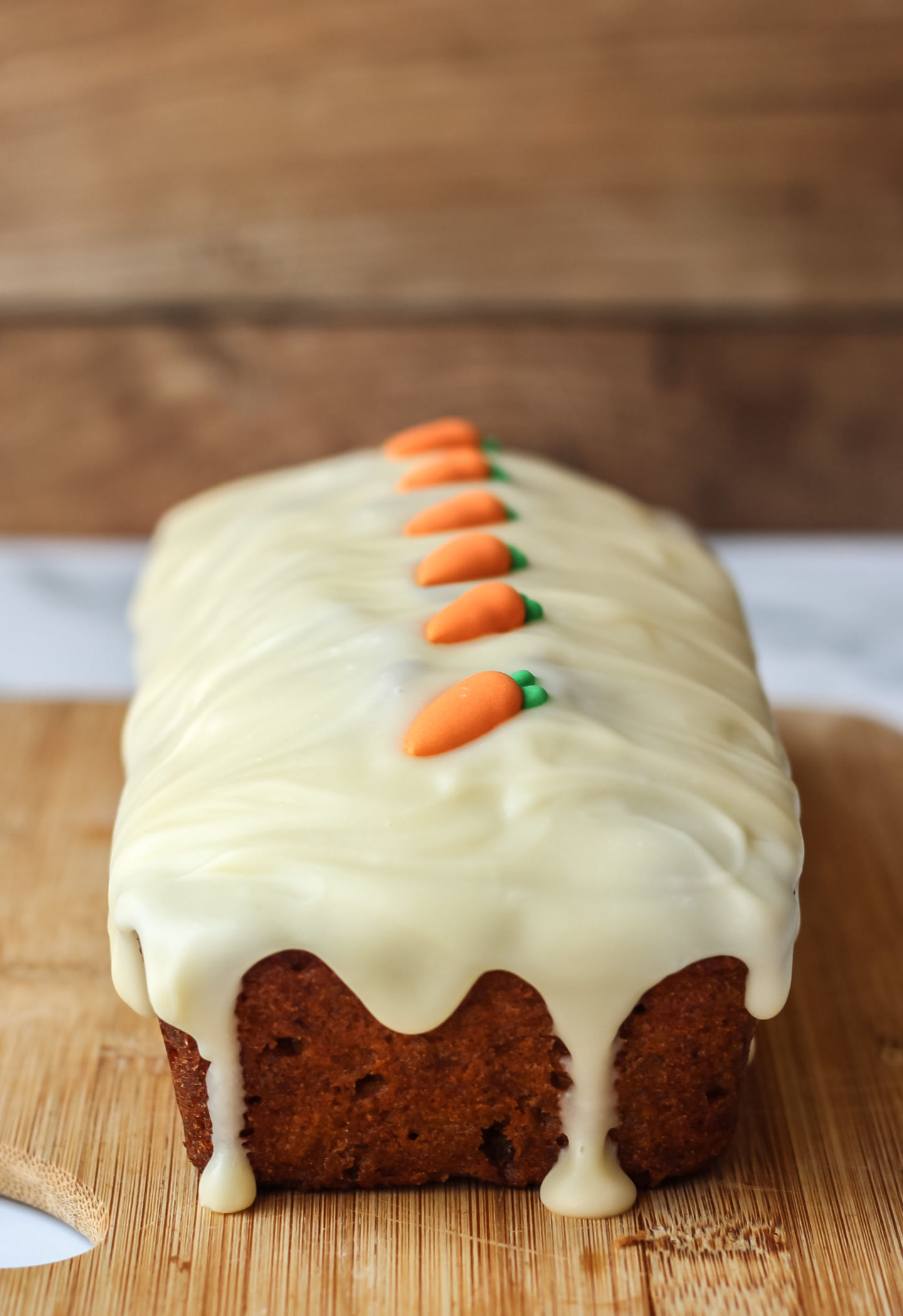 close up of loaf cake with icing drip