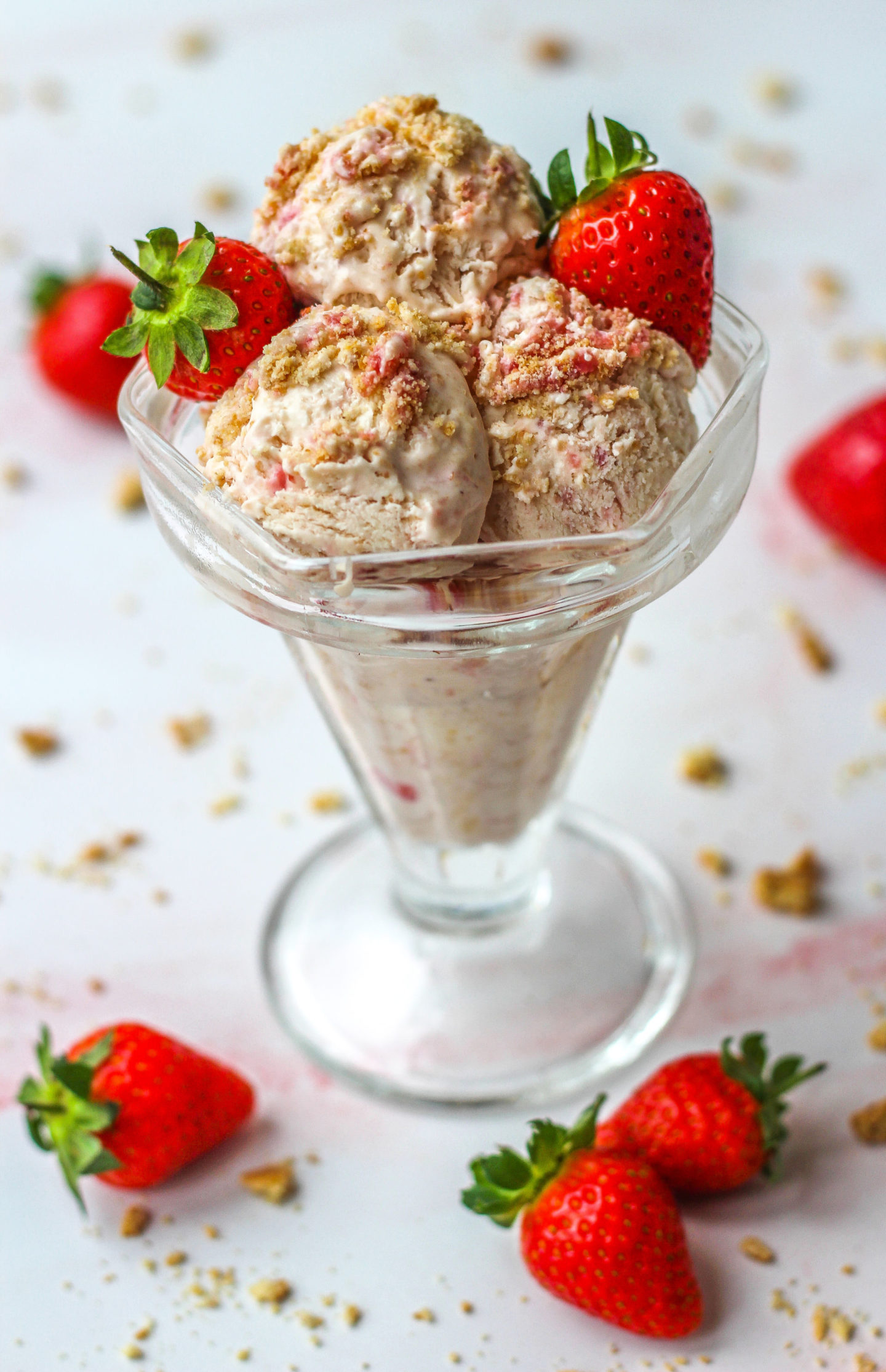 sundae dish with strawberry cheesecake ice cream