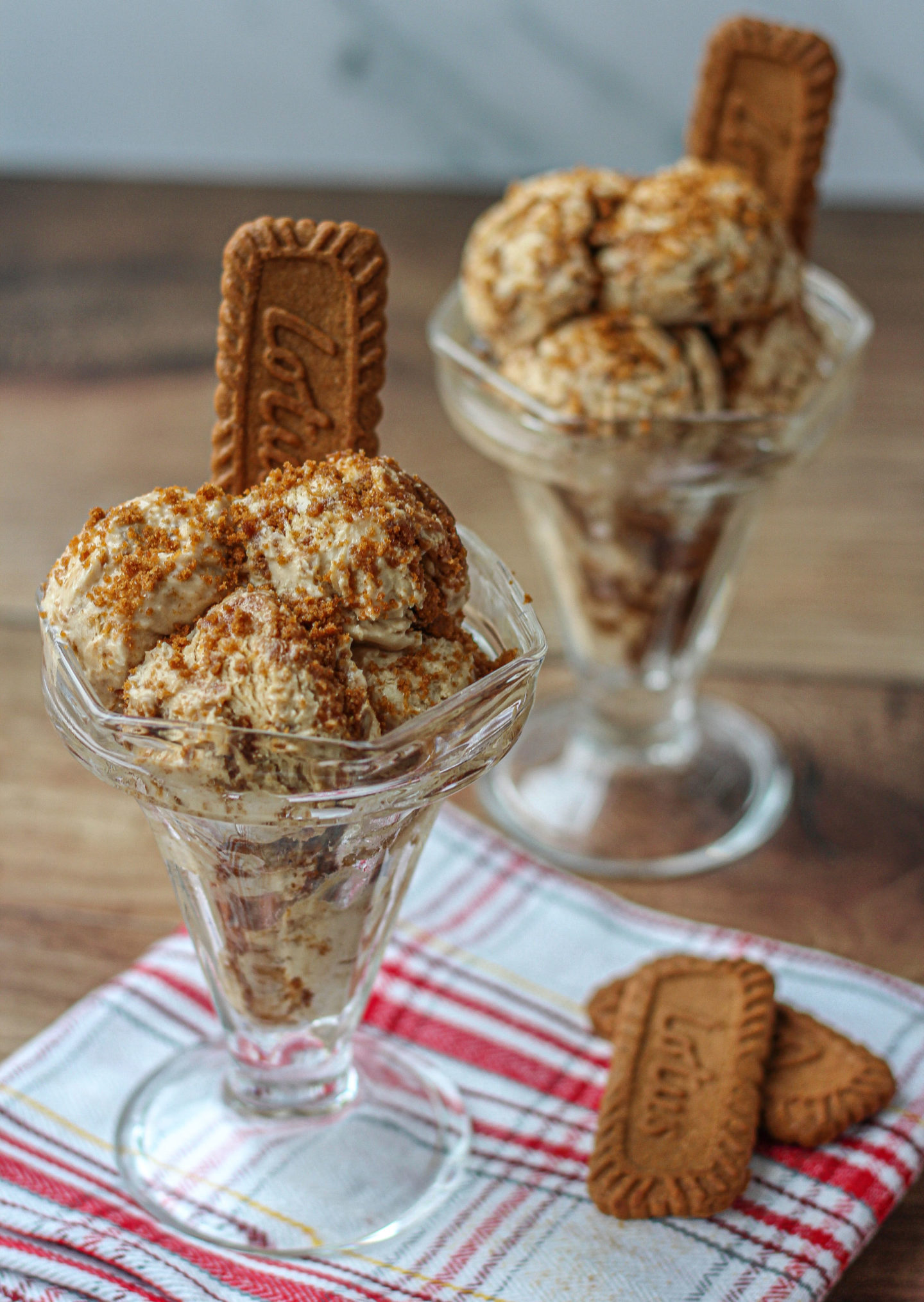 two biscoff ice cream sundaes with biscoff biscuits