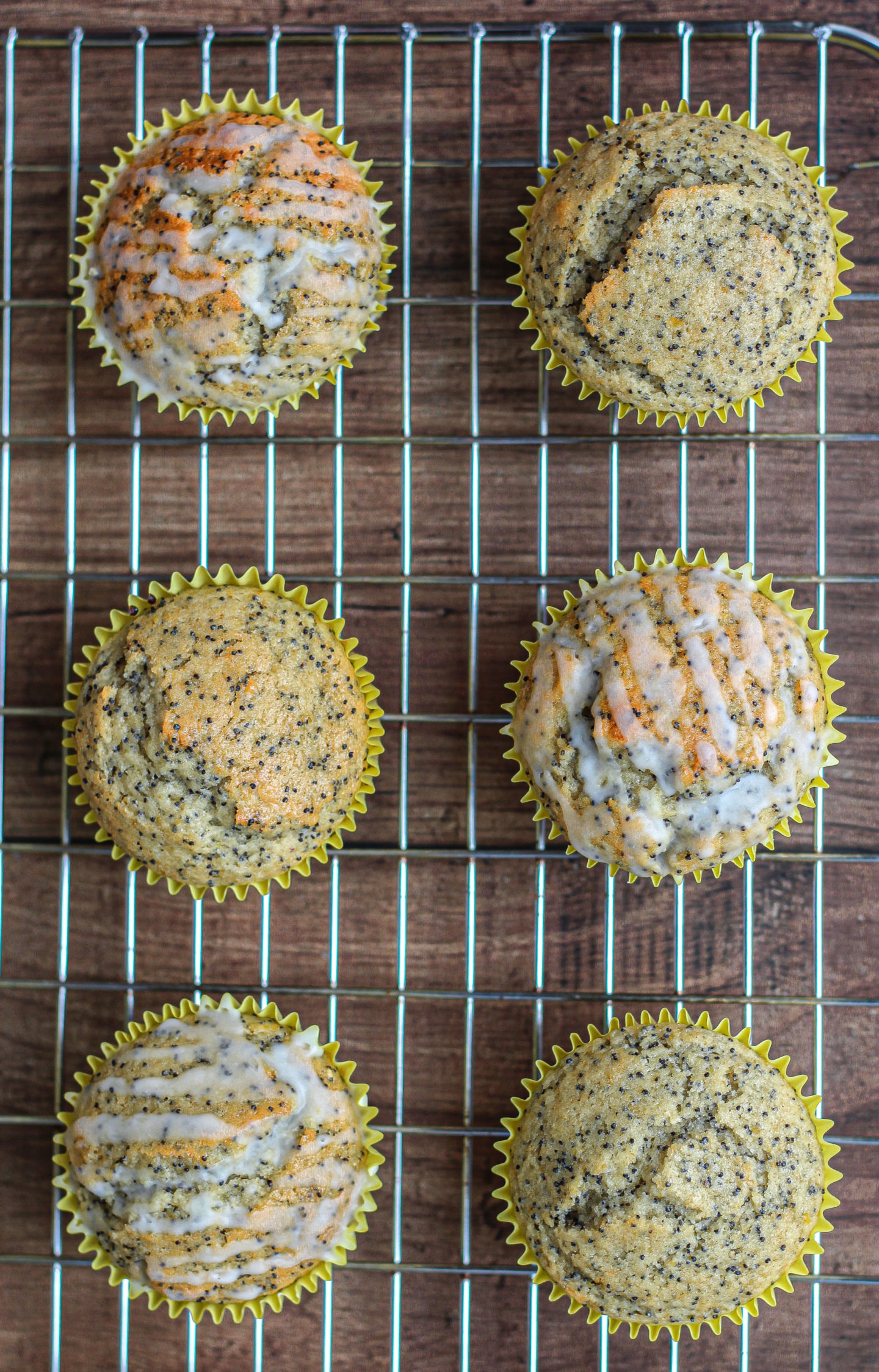 close up of tops of lemon poppy seed muffins shown from above