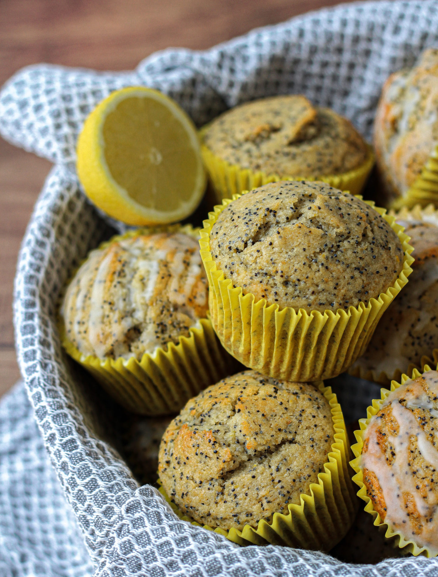 basket of lemon poppy seed muffins, with and without lemon glaze