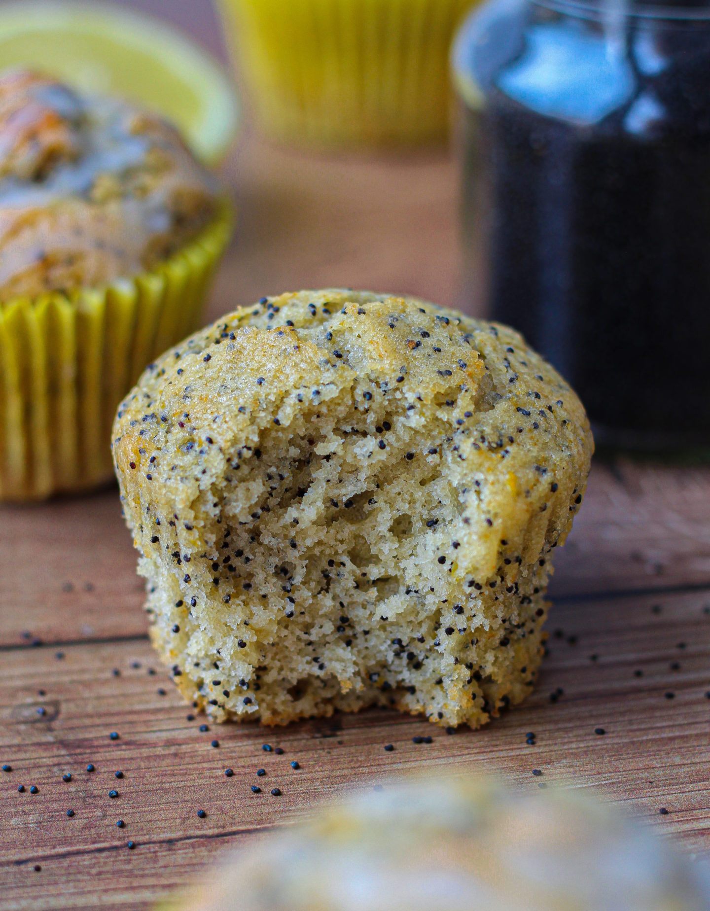 close up of inside of lemon poppy seed muffin with bite taken out of it 