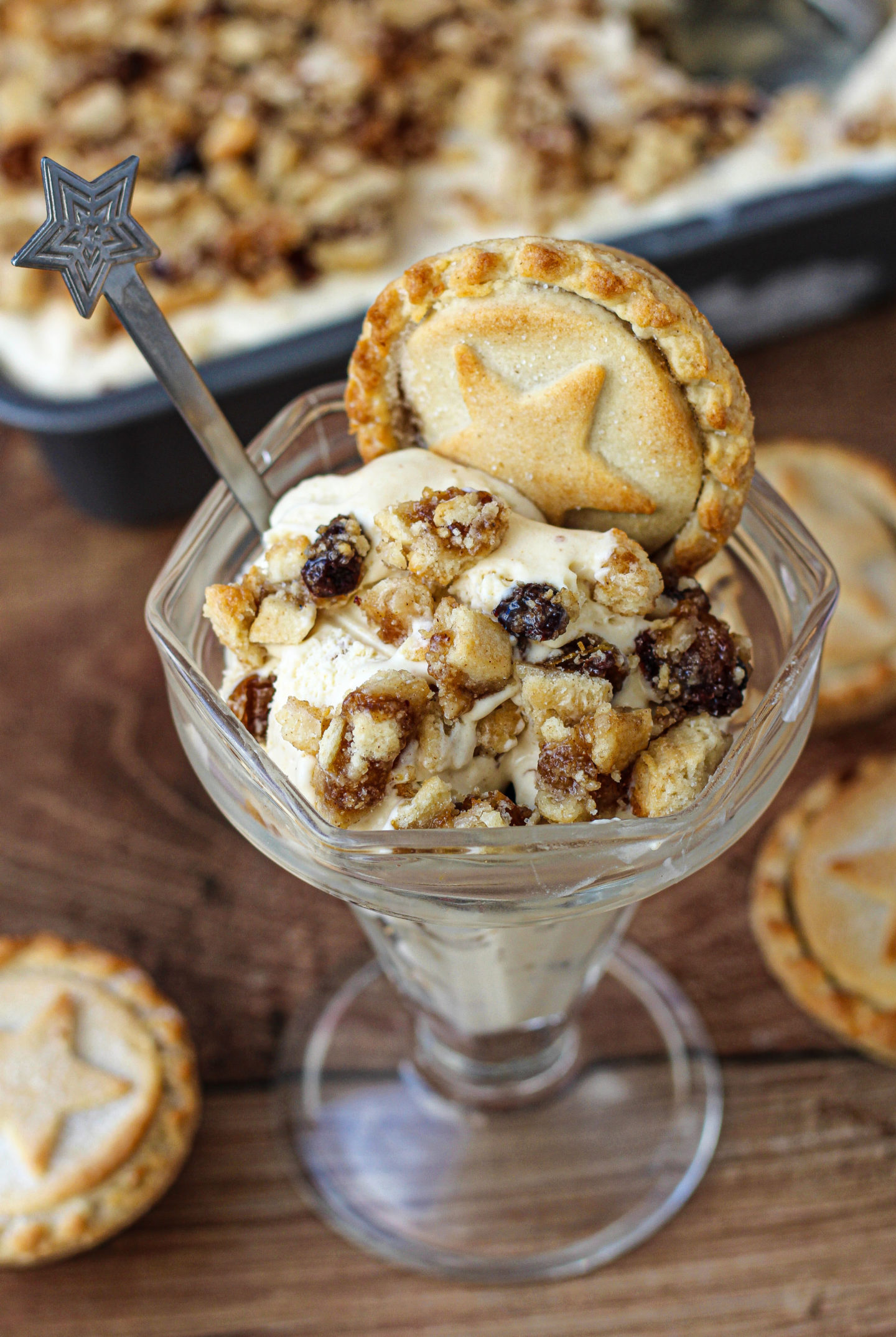 no-churn mince pie ice cream in sundae dish with loaf tin of ice cream in background