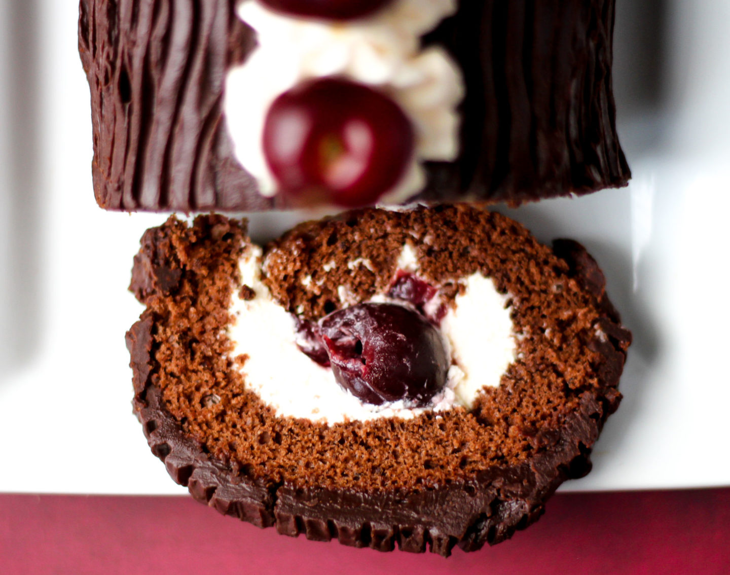 view from above of slice of black forest swiss roll