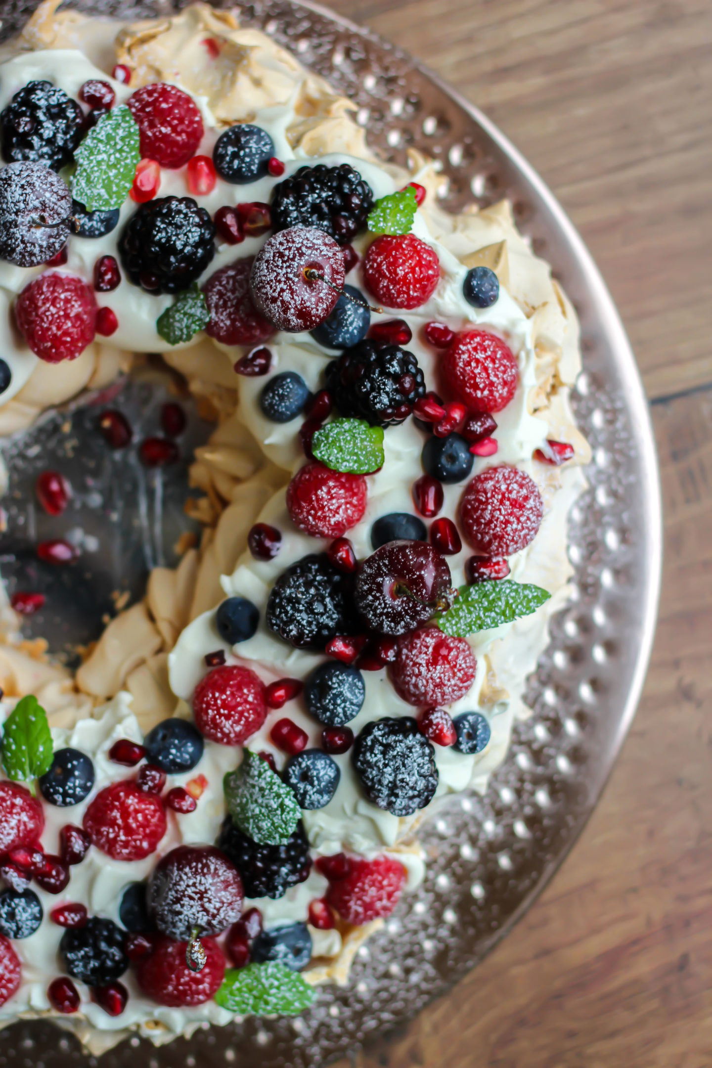 side view from above of Christmas berry pavlova wreath