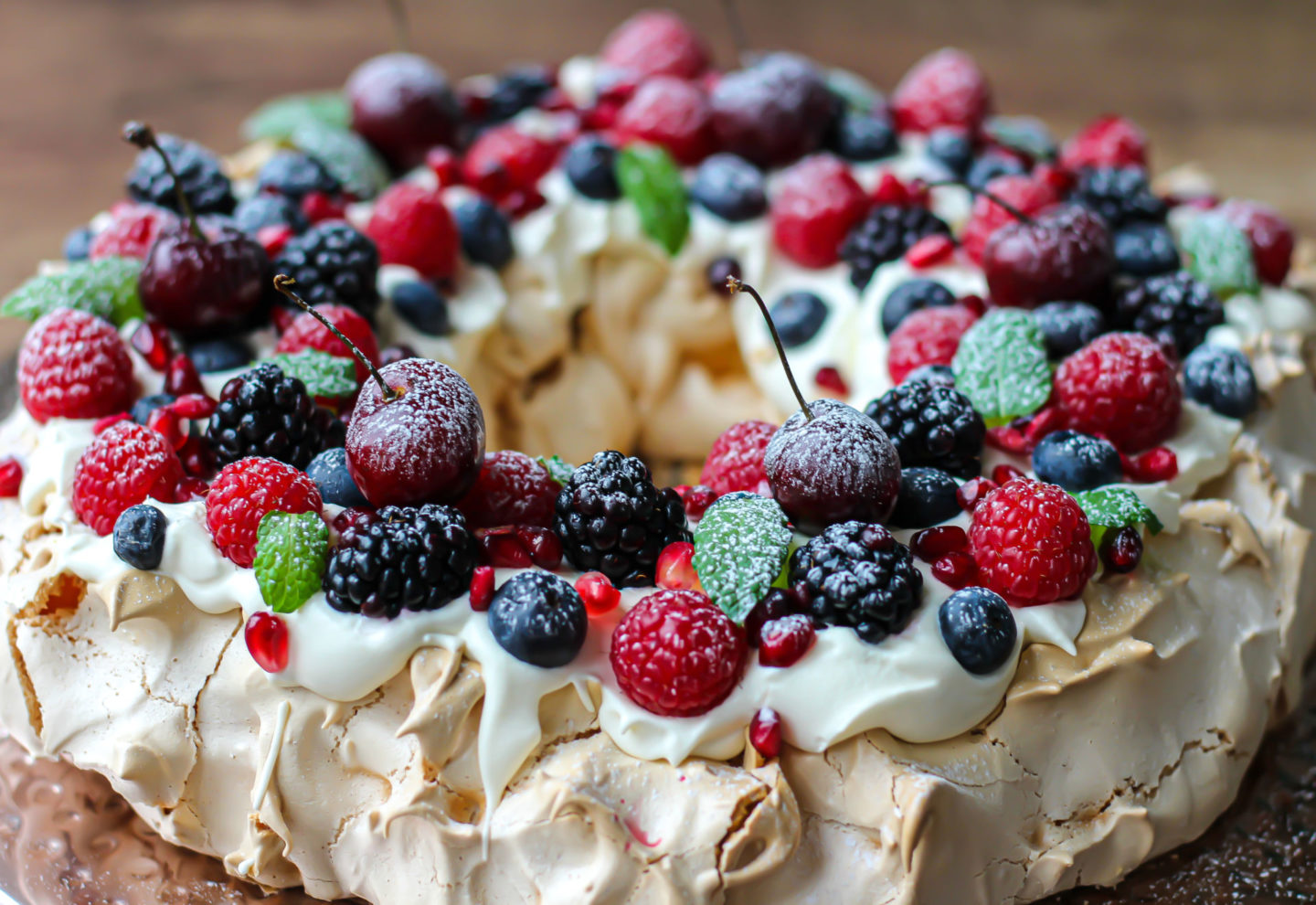 close up of whole Christmas berry pavlova wreath