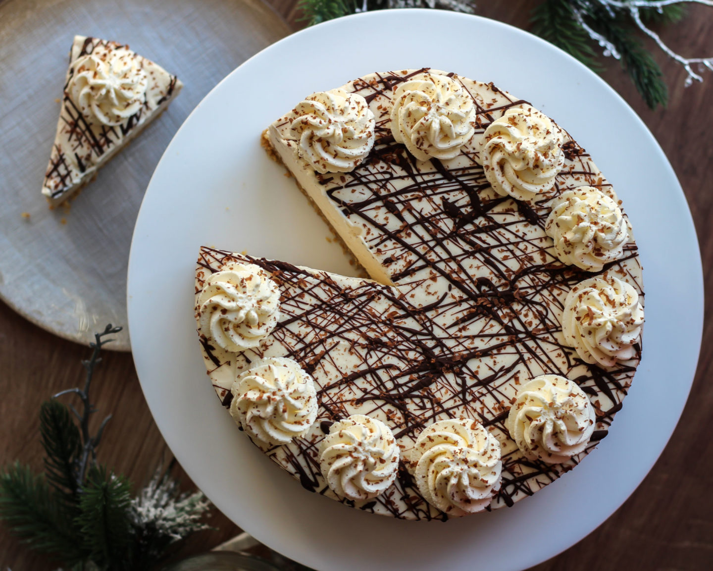 View from above of no-bake Baileys cheesecake with a slice taken from it