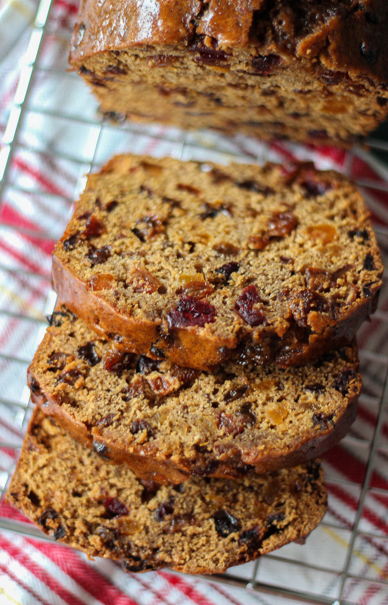 three slices of bara brith on top of each other on wire rack