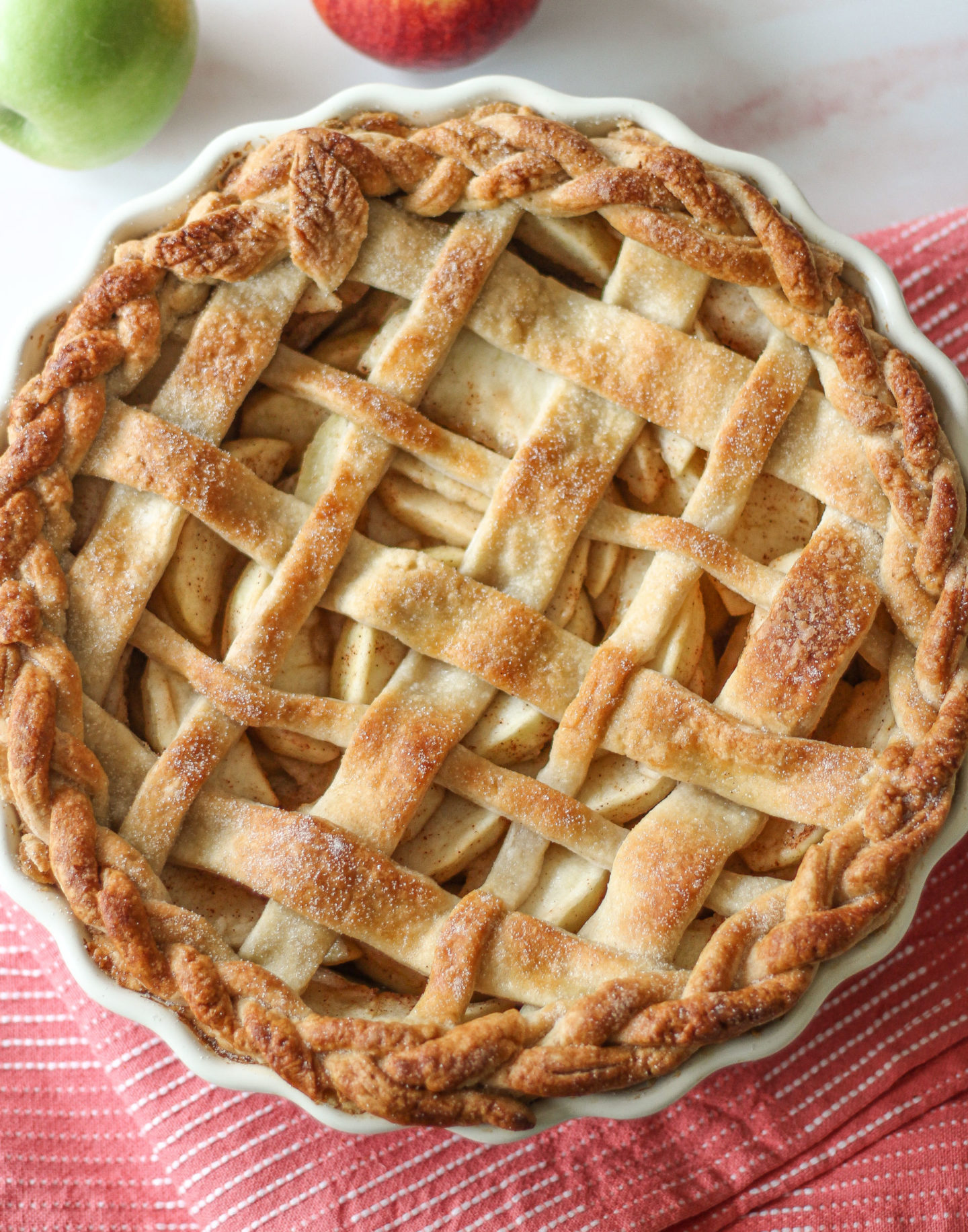 overhead view of whole uncut lattice apple pie