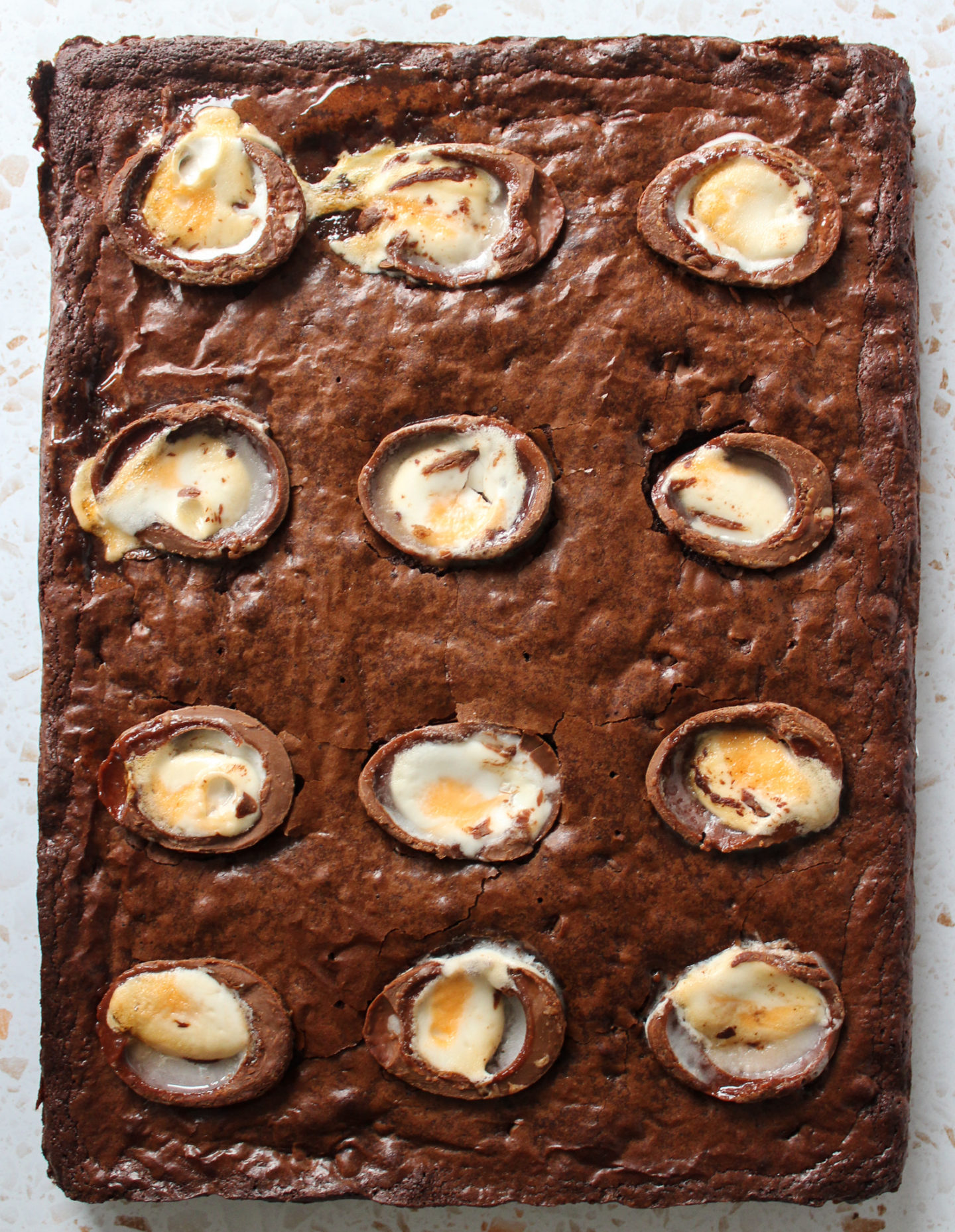 view from above of whole uncut chewy creme egg brownie bake before being sliced