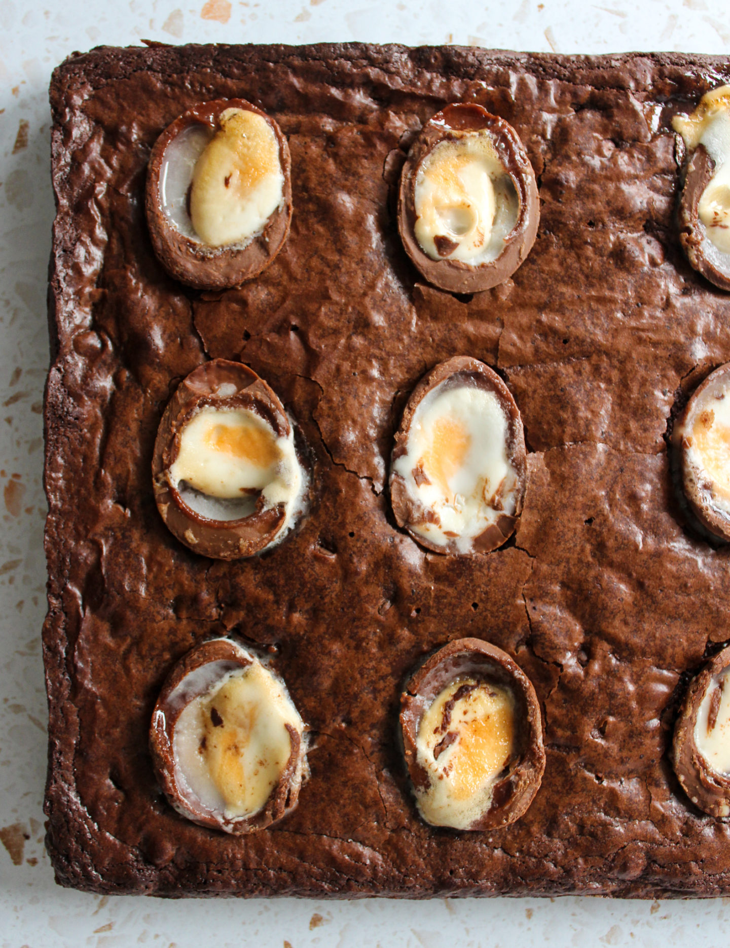 view from above of uncut chewy creme egg brownies before being sliced 