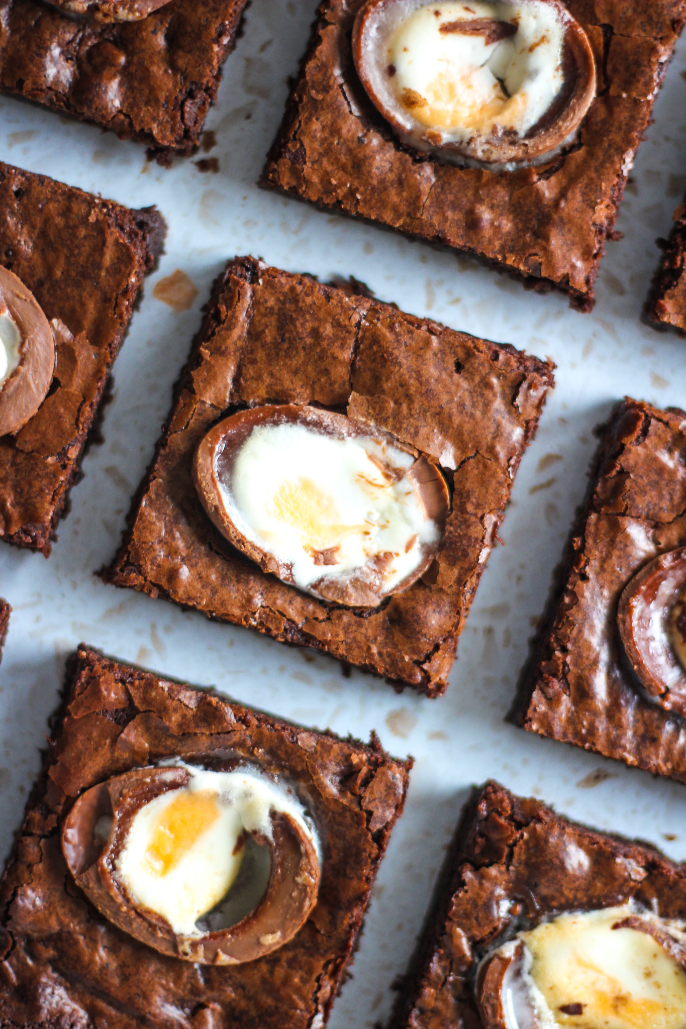 close up view from above of a chewy creme egg brownie surrounded by other brownie slices